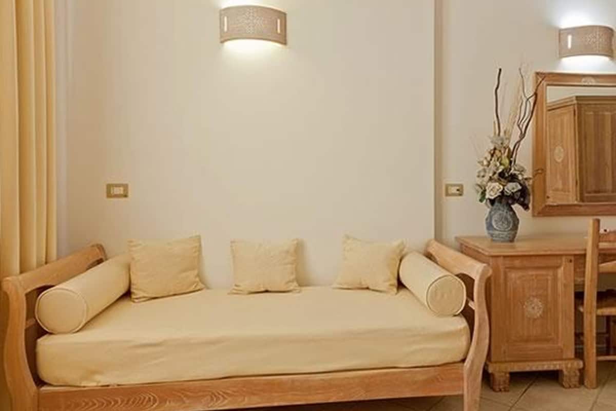 family room | 1 bedroom, minibar, in-room safe, desk