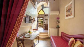 Luxury Apartment, Multiple Beds, Garden View | Living area | 33-inch LED TV with satellite channels, TV
