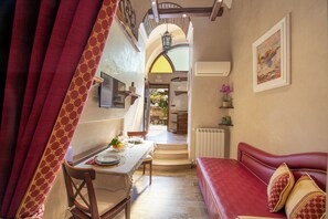 Luxury Apartment, Multiple Beds, Garden View | Living area | 33-inch LED TV with satellite channels, TV