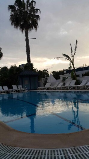 Outdoor pool, pool umbrellas, sun loungers