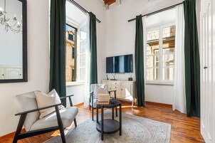 Deluxe Suite, City View | Living area | TV, DVD player