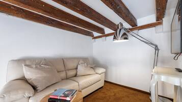 Deluxe Double Room | Living area | TV, DVD player