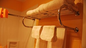 A bathroom with a towel rack holding two towels. - Imperial Motel (Cortland)