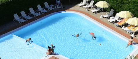 Seasonal outdoor pool, pool umbrellas, sun loungers