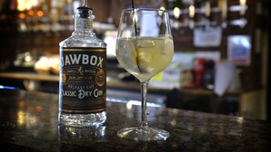 A bottle of whiskey and a glass of whiskey on a bar counter. - Dobbins Inn (Carrickfergus)