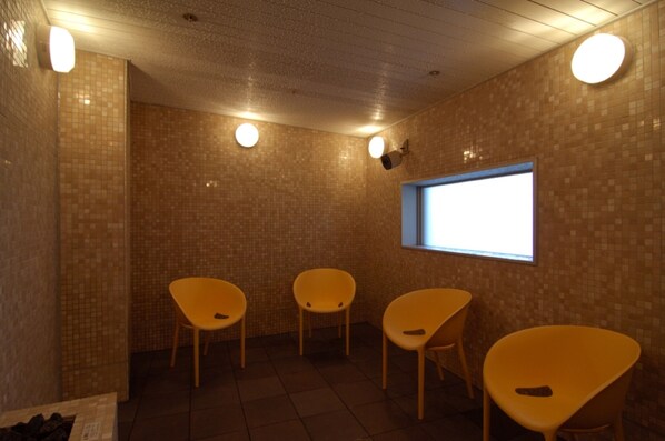 A room with tiled walls, a window, and four yellow chairs. - Maihama View Hotel by HULIC (Urayasu)
