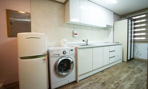 Fridge, electric kettle, cookware/dishes/utensils