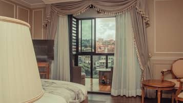 Deluxe Room, 1 King Bed, Non Smoking, City View | Living area | Flat-screen TV