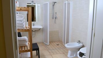 Quadruple Room | Bathroom | Shower, free toiletries, hair dryer, towels