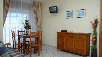 32-inch flat-screen TV with satellite channels, TV