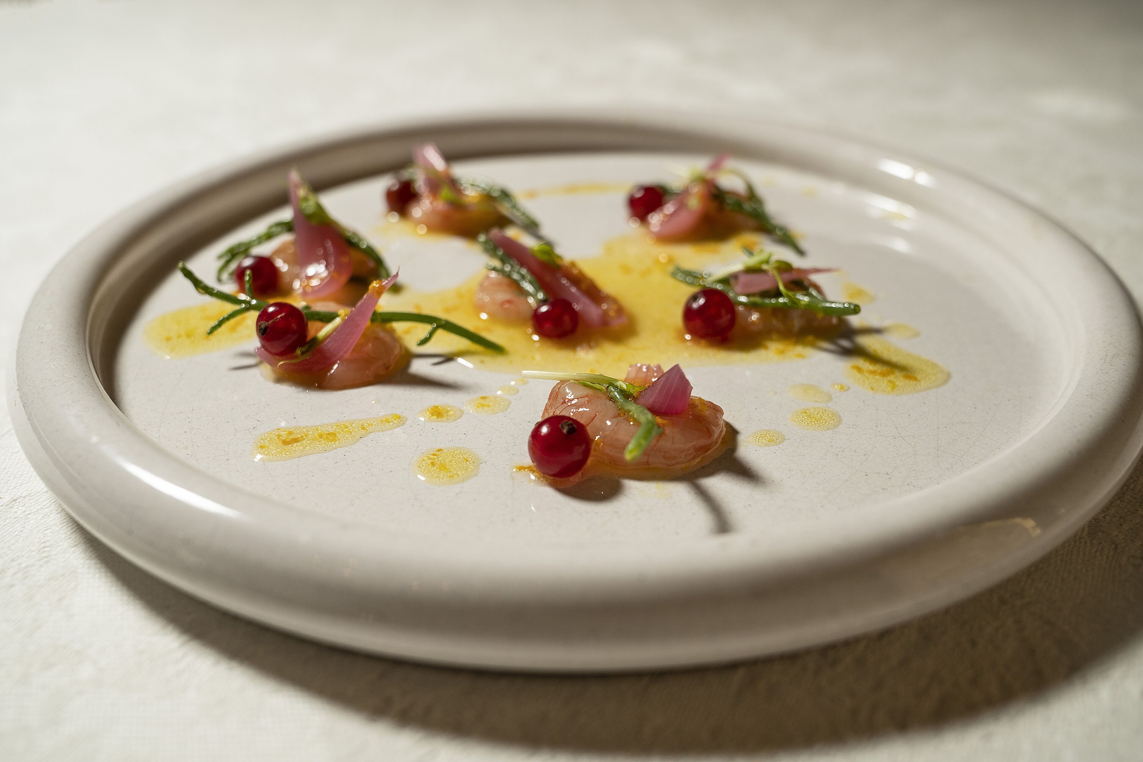 A white plate with a food arrangement.
