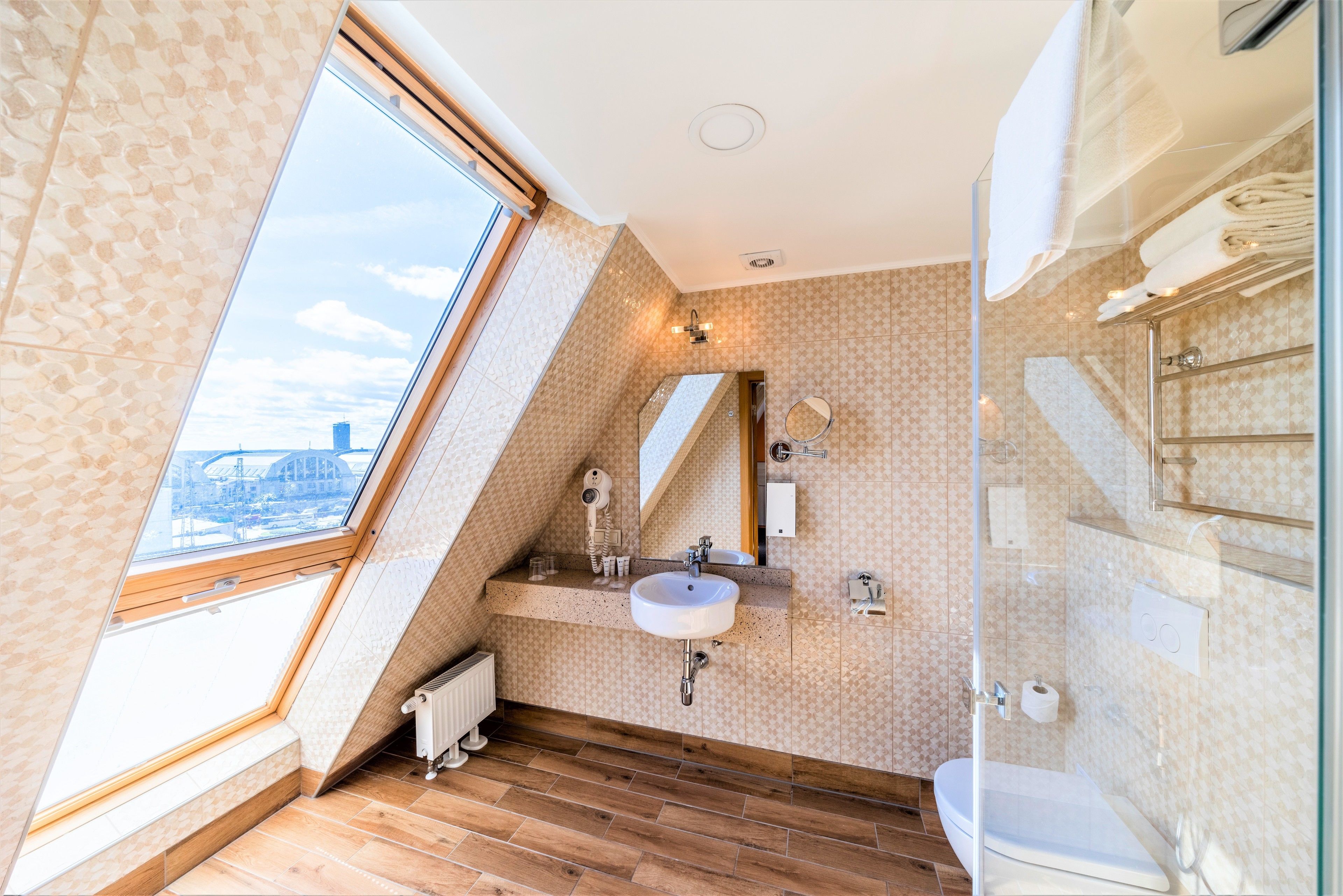 free toiletries, hair dryer, heated floors, towels