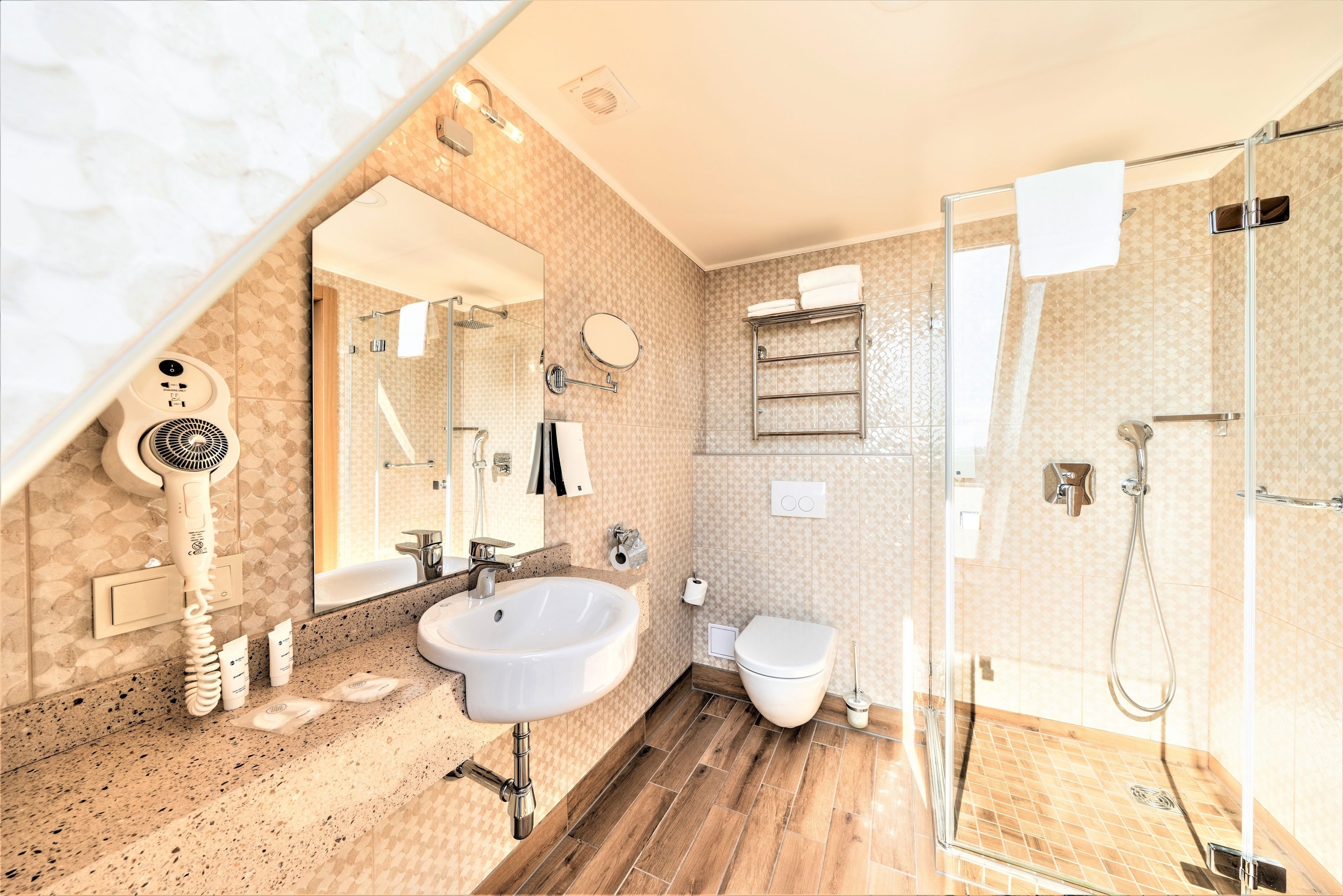 free toiletries, hair dryer, heated floors, towels