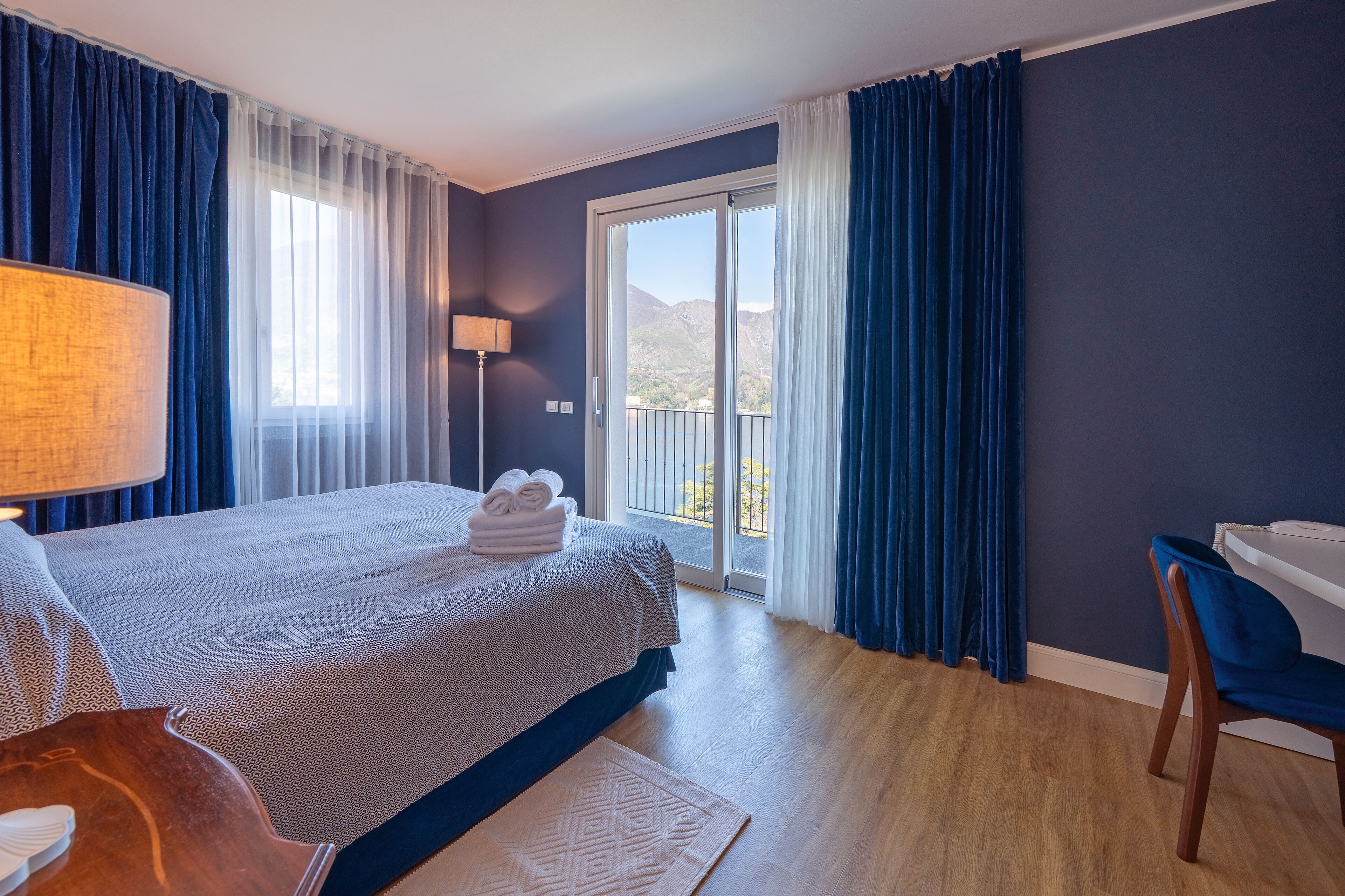 Junior Suite, Lake View | Down duvets, minibar, in-room safe, desk