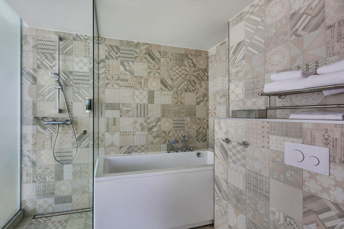 suite | bathroom | shower, hair dryer, bathrobes, heated floors