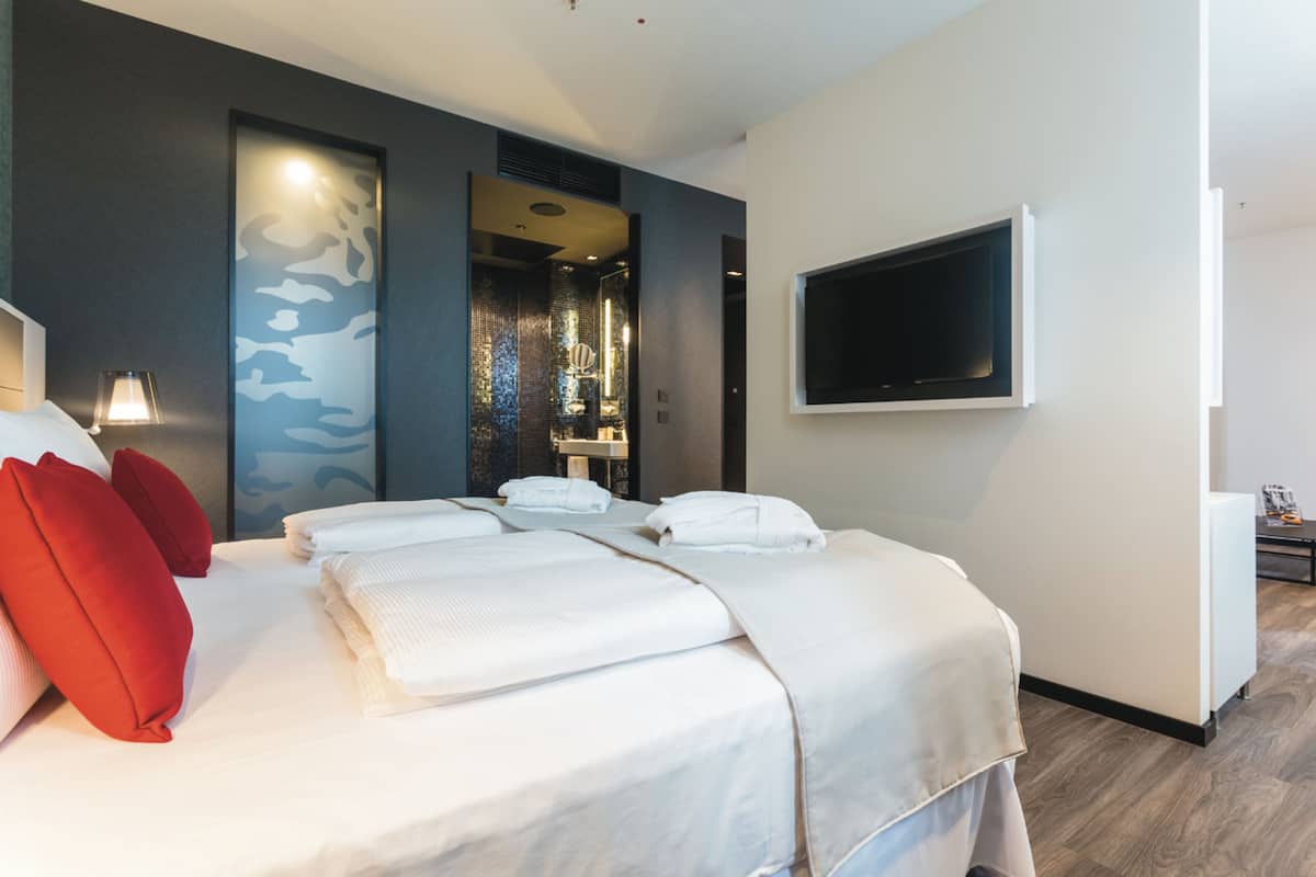 Junior Studio Suite, 1 King Bed (Family) | 2 bedrooms, down duvets, in-room safe, desk