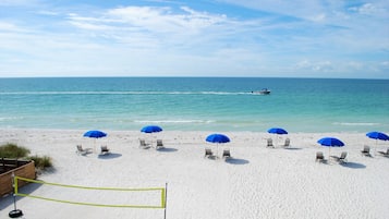 On the beach, sun-loungers, beach umbrellas, beach towels