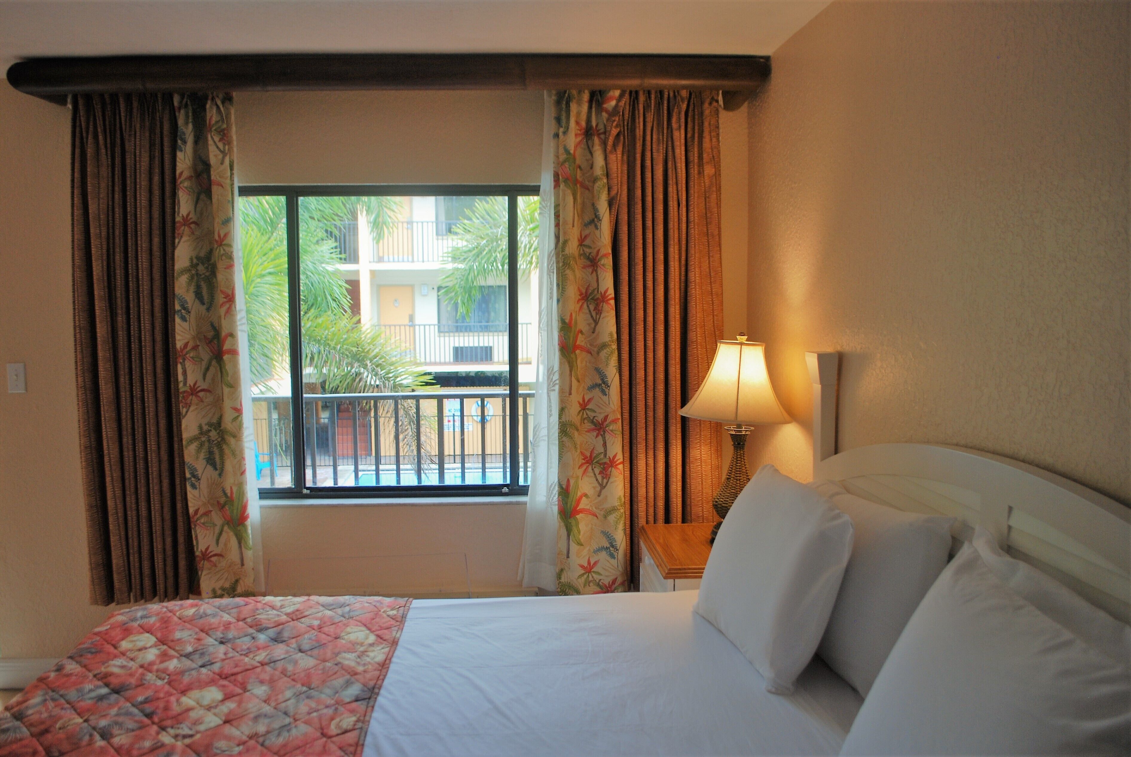 1 bedroom poolside suite | individually decorated, individually furnished, blackout curtains