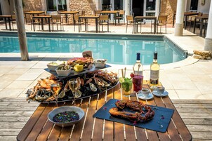 Dinner served, Regional cuisine, pool views 