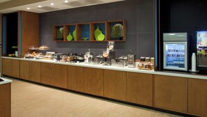 A modern breakfast bar with a variety of food items and a coffee station. - Springhill Suites Mobile (Mobile)