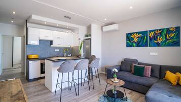 Superior Apartment, 1 Bedroom, Balcony, Sea View | Living area | 40-inch flat-screen TV with cable channels, TV
