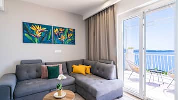 Superior Apartment, 1 Bedroom, Balcony, Sea View | Living area | 40-inch flat-screen TV with cable channels, TV