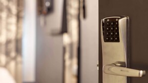 A modern door with a built-in keypad lock. - B&B Hôtel Nantes Centre (Nantes)