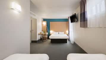A hotel room with a large bed, two bedside tables, a desk with a chair, and a TV mounted on the wall.