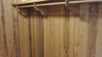 A room with wooden panel walls and a wooden floor.