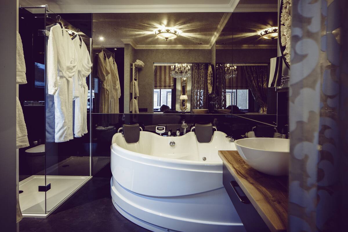 deluxe room, 1 king bed, jetted tub (flower room) | bathroom | shower, rainfall showerhead, designer toiletries, hair dryer