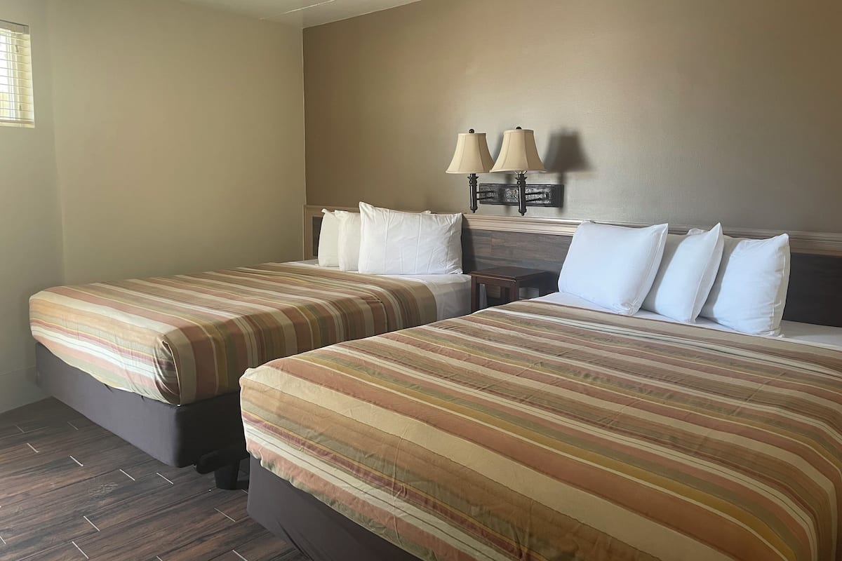 Deluxe Suite, Kitchenette (Private Balcony with two Queen Bed) | 1 bedroom, individually decorated, free WiFi, bed sheets