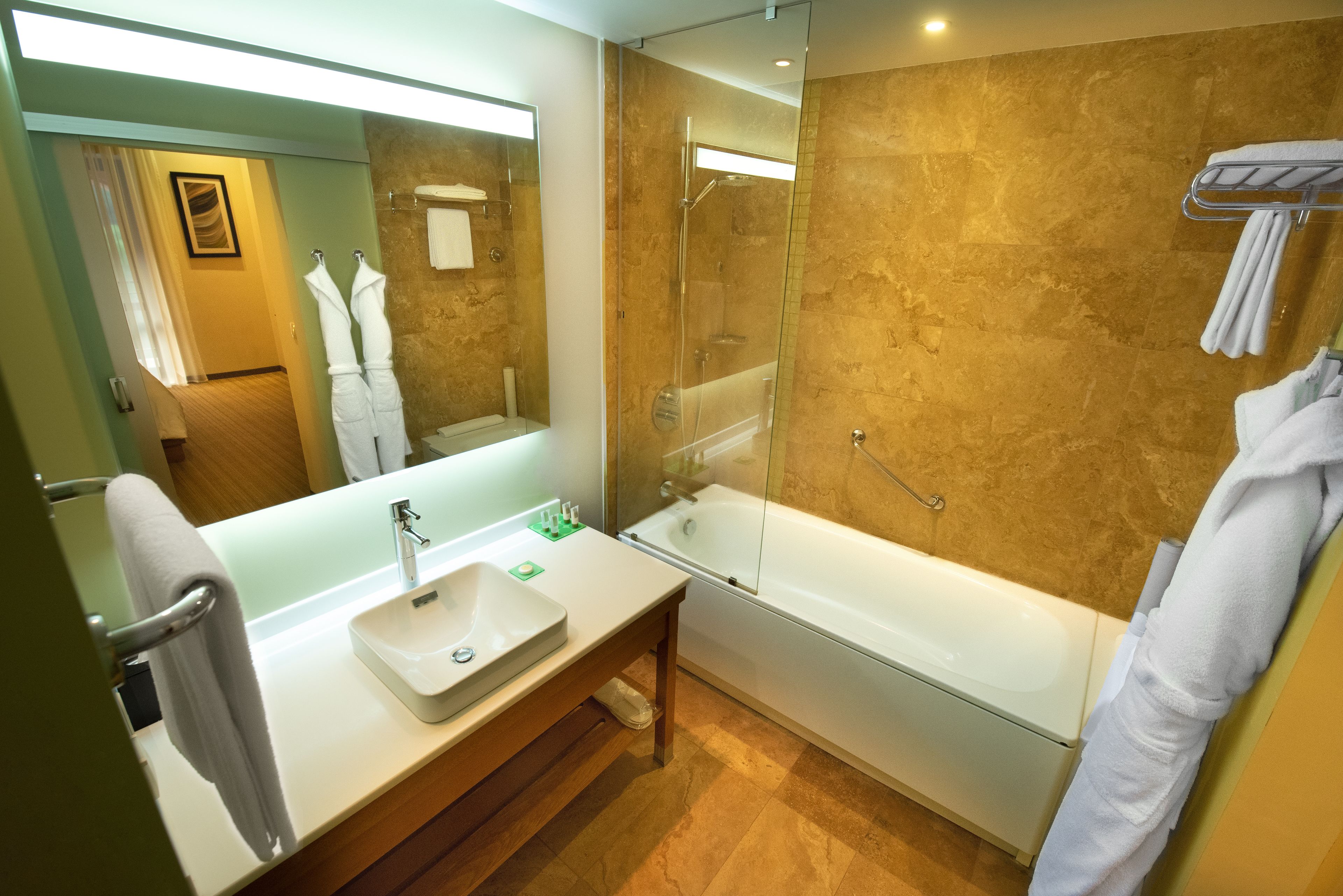 suite | bathroom | designer toiletries, hair dryer, bathrobes, slippers