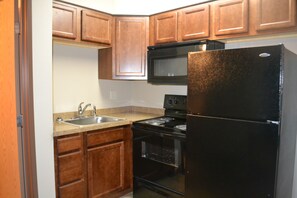 Traditional Studio | Private kitchen | Full-sized fridge, microwave