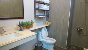 Shower, free toiletries, hair dryer, slippers