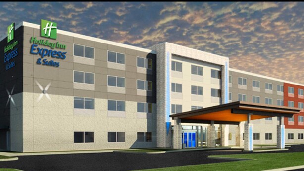 A Holiday Inn Express & Suites building with a covered entrance and multiple floors. - Holiday Inn Express & Suites Dearborn SW - Detroit Area by IHG (Dearborn)