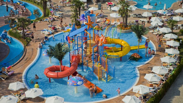 A water park with slides, pools, and sun loungers. - DIT Evrika Beach Club Hotel (Nessebar)