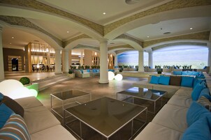 4 bars/lounges, poolside bar, beach bar