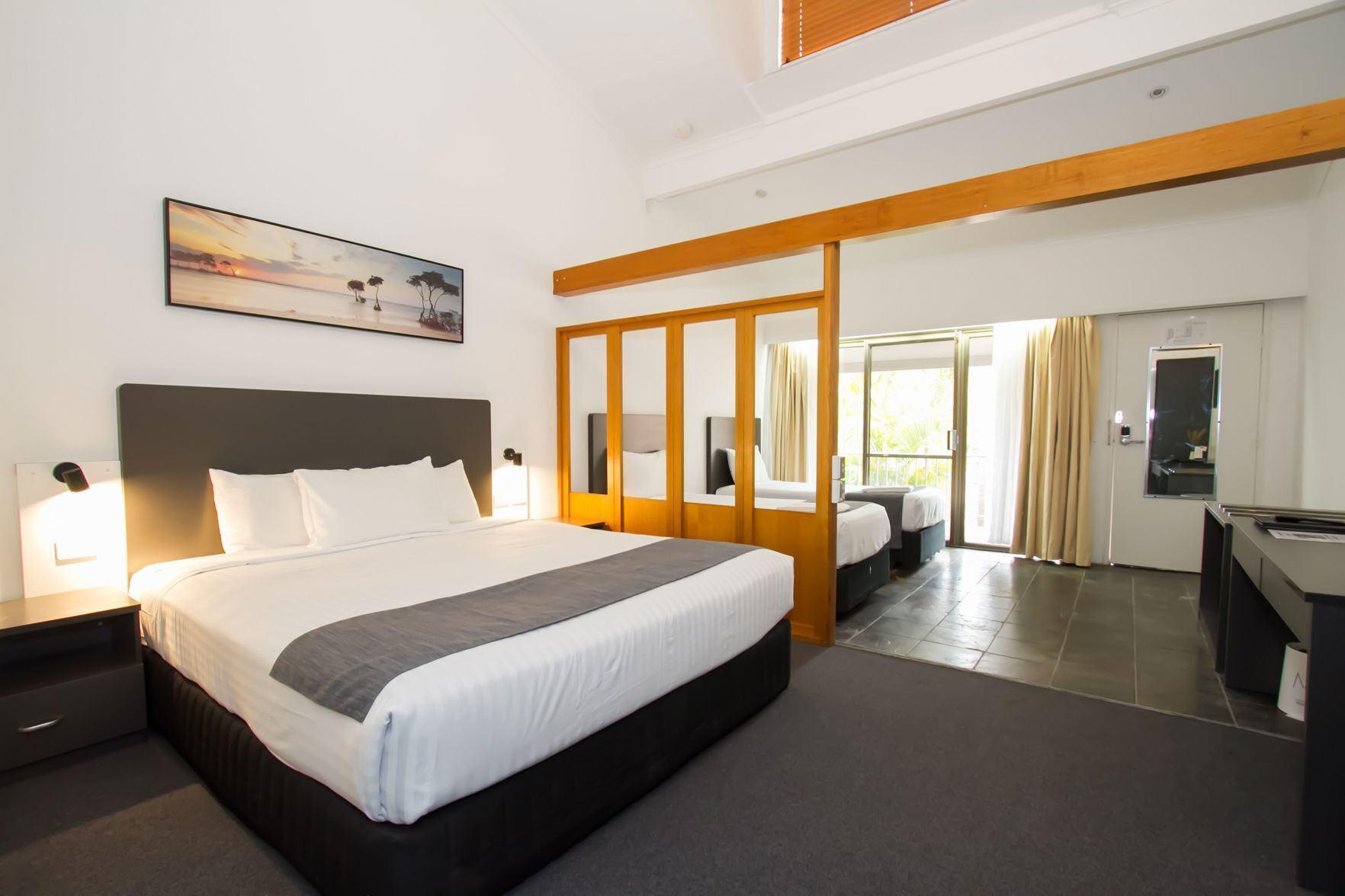 Premium bedding, pillow-top beds, desk, laptop workspace