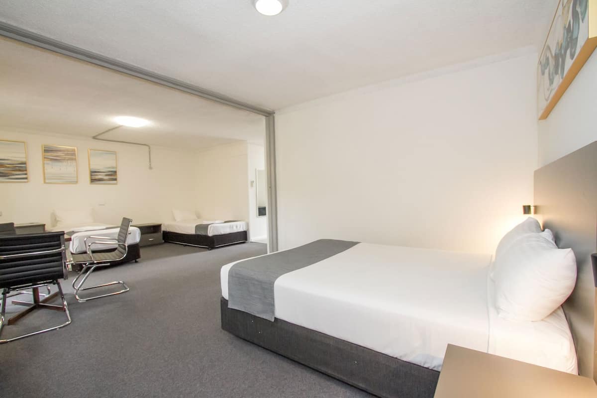 Premium bedding, pillow-top beds, desk, laptop workspace