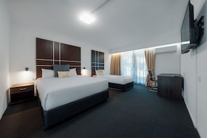 Premium bedding, pillowtop beds, desk, laptop workspace