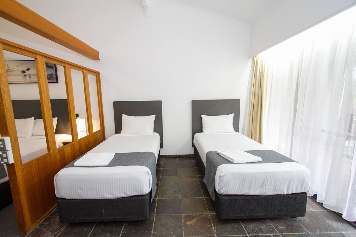 Premium bedding, pillowtop beds, desk, laptop workspace