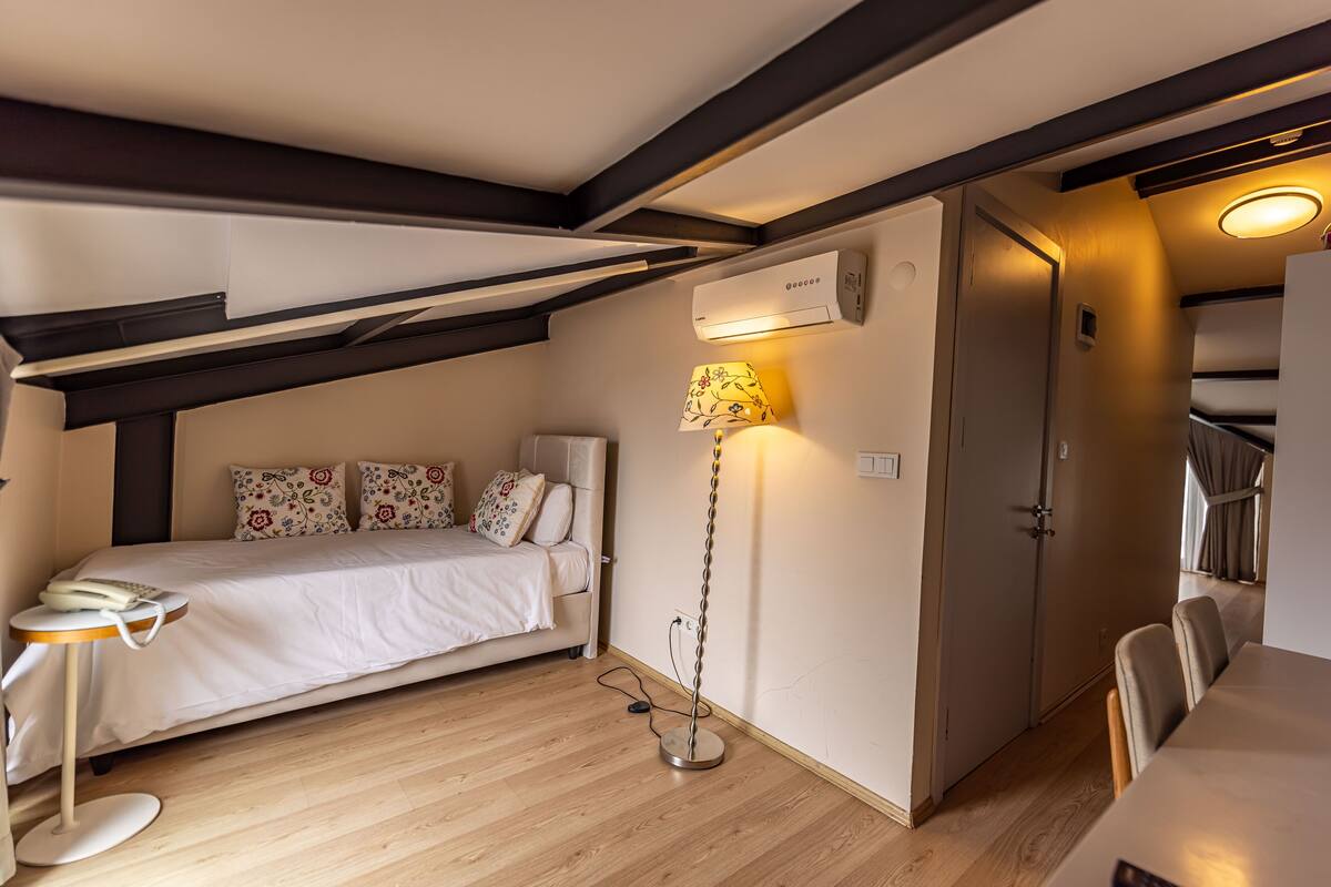 Family Triple Room, Terrace | Minibar, in-room safe, desk, laptop workspace