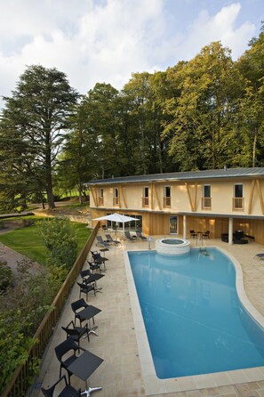 Seasonal outdoor pool, open 9:00 AM to 8:00 PM, pool umbrellas