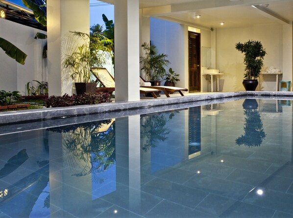 Indoor pool, pool umbrellas, sun loungers