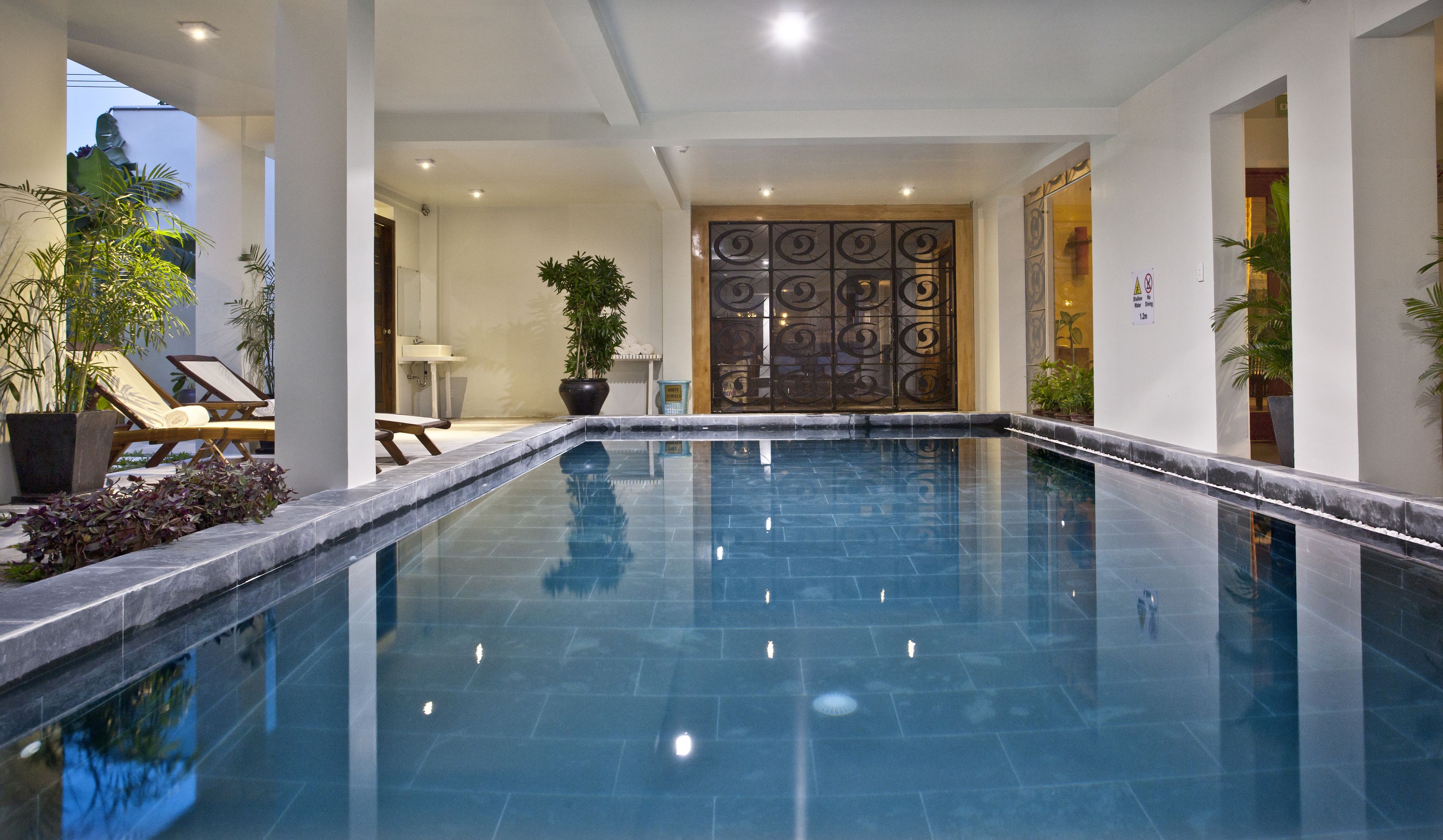 indoor pool, pool umbrellas, pool loungers