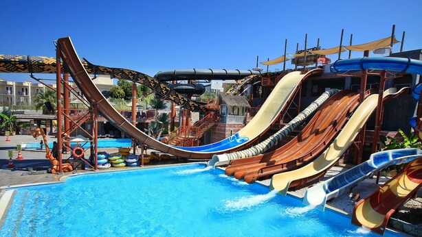 A water park with multiple slides over a pool. - Cactus Fleur Bay Resort - All inclusive (Bodrum)