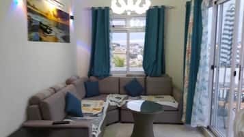 Comfort Penthouse, 2 Bedrooms, Mountain View | Living room | Flat-screen TV