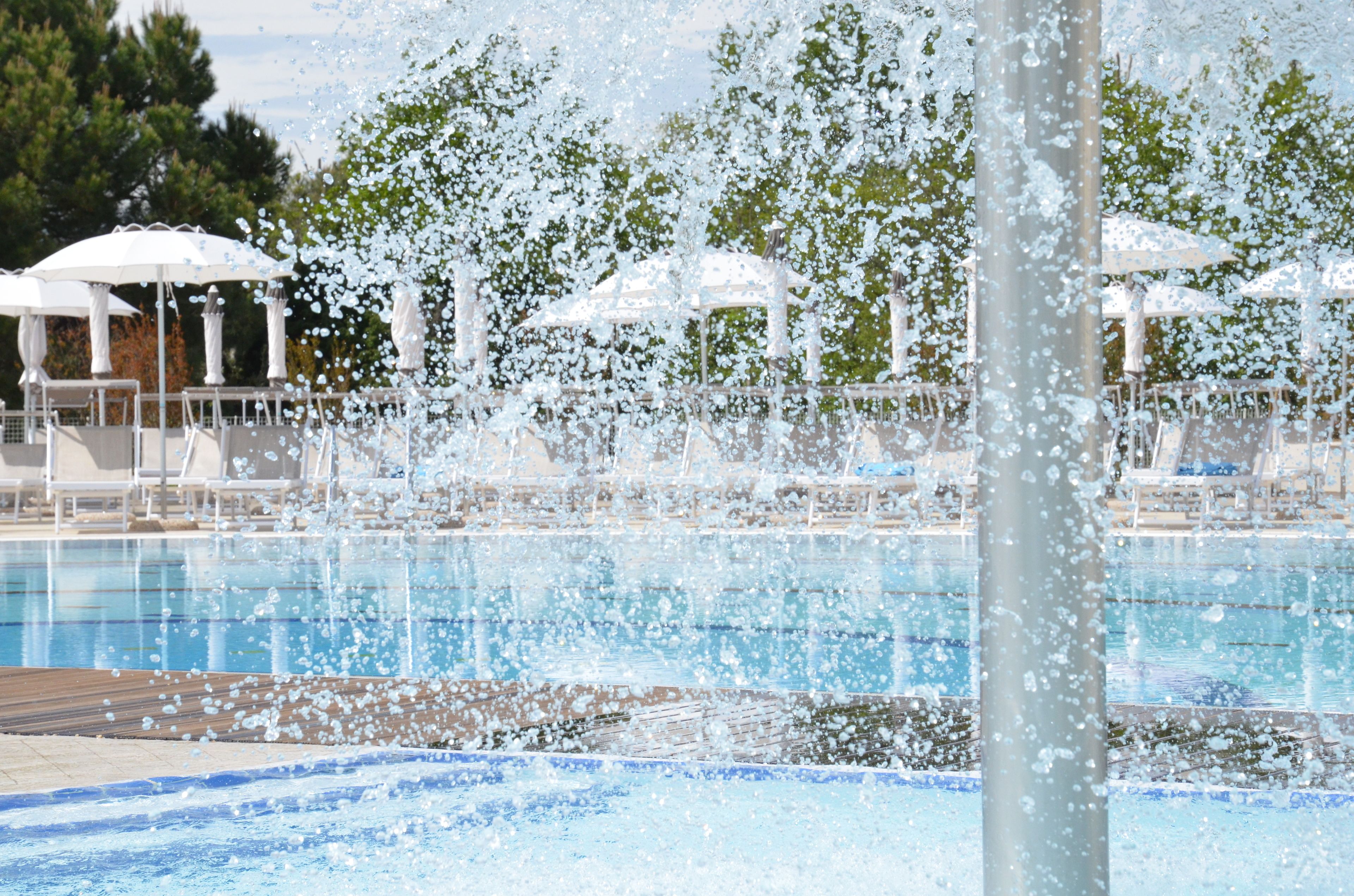 seasonal outdoor pool, pool umbrellas, pool loungers