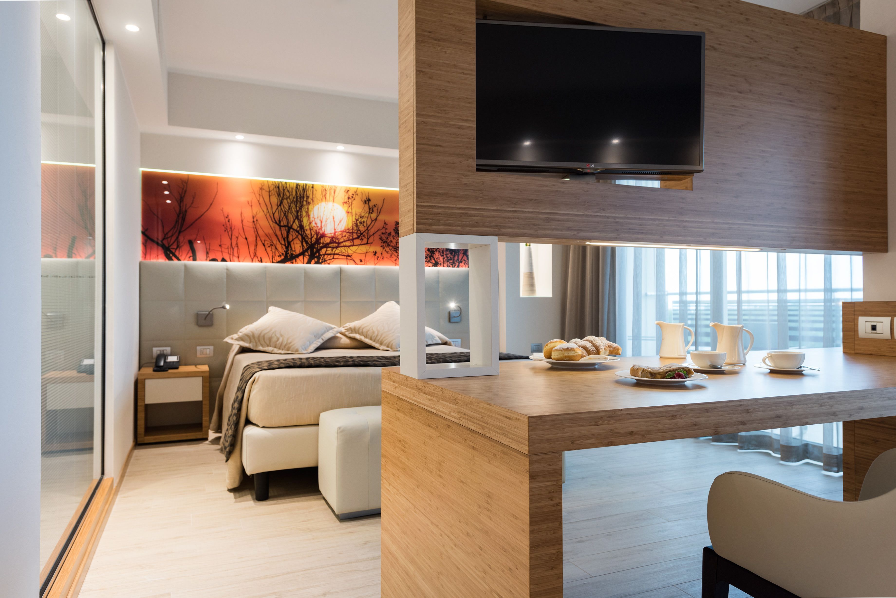 junior suite, partial sea view | premium bedding, minibar, in-room safe, desk