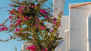 A white building with a staircase and a tower. - La Stella Stay (Mykonos)